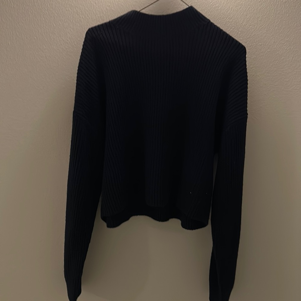 Navy blue sweater with white and red stripes on sleeves!